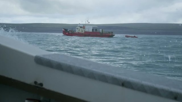 Epic view of fishing toristic boat at north summer Barents sea, stormy weather, waves