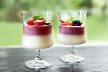 Sweet summer layered dessert with fresh berries