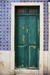 Old wooden door on facade wall