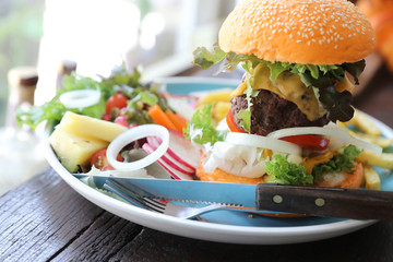 Beef hamburger fastfood on wooden table