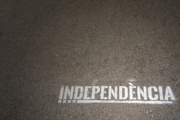 Fototapeta na wymiar white Independence word written on asphalt, independencia