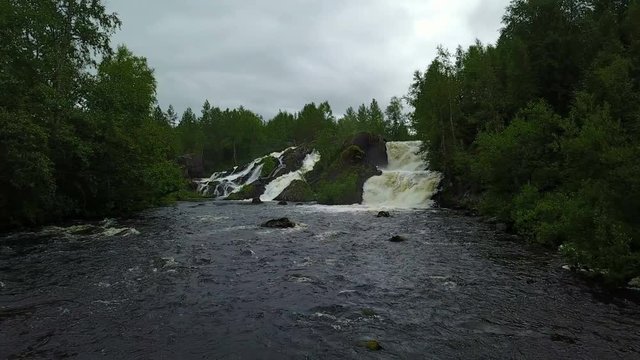 Moving to waterfall treshold of Shuoniyoki at Kola peninsula, Russia