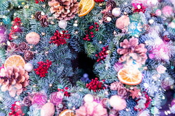 Naklejka na ściany i meble New Year's wreath of spruce and Christmas decorations