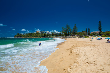 CALOUNDRA, AUS - DEC 28 2018: Hot sunny day at Moffat Beach, Calundra, Queensland, Australia