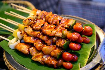 Grilled pork with BBQ sauce on sticks, thailand street food