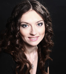 closeup of beautiful young woman in evening black dress