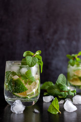 Mojito Cubano or caipirinha cocktail, iced drink with lime and mint