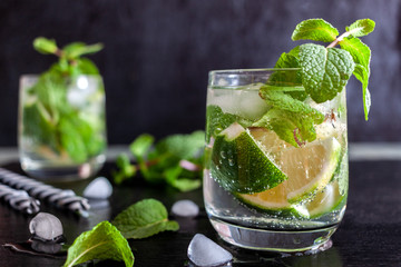Mojito Cubano or caipirinha cocktail, iced drink with lime and mint
