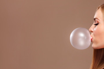 Beautiful Blonde Woman Beauty Model Girl on light copyspace with gum