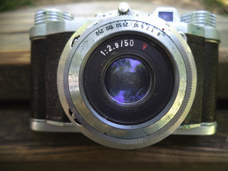 old camera lens on white background