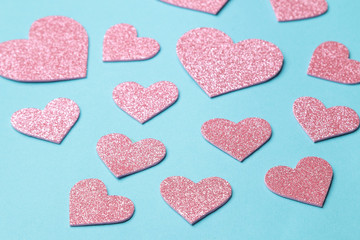 Pink hearts on a bright blue background. frame of hearts, with space for text