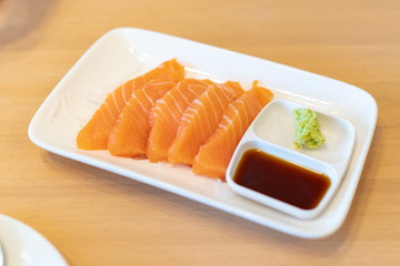 Salmon Slides with Wasabi in a Japanese Restaurant