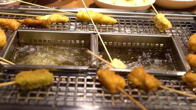 Japanese Osaka trendy food, skewer fried food feast at restaurant