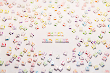 Conceptual of Happy New Year Words made with Colorful Alphabetical Beads