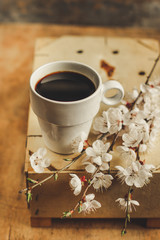 coffee in a cup on the table and primrose on the table (aroma). copy space. top