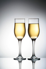 Two elegant glasses with sparkling champagne Holiday card Christmas, New Year, wedding. Celebration concept advertising design