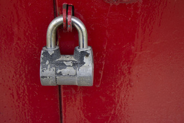 padlock on a red metal door