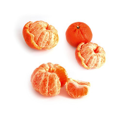 A set of different view of mandarins. Unpeeled mandarin, a couple of tangerines, a clementine, isolated on white background.