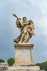 Obraz premium Marble Angel with the Cross, outside the Castle of the Holy Angel (Italian Castel Sant'Angelo), or Mausoleum of Hadrian