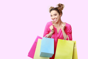 Fototapeta premium Lady posing with shopping bags and looking at camera