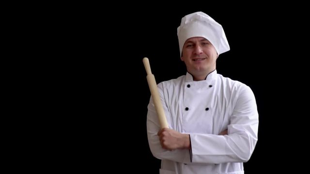 cooking, profession and people concept - happy male chef cook holding rolling pin