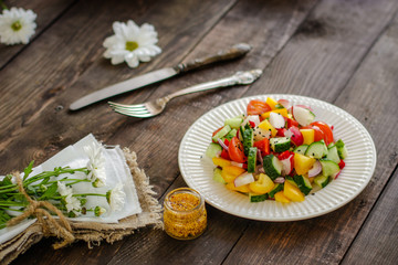 salad from fresh vegetables (tomato, cucumber, radish, pepper, arugula and other vegetables). copy space. top