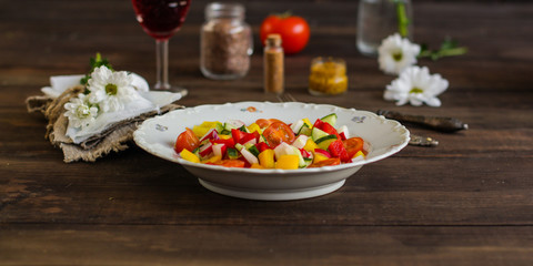 salad from fresh vegetables (tomato, cucumber, radish, pepper, arugula and other vegetables). copy space. top