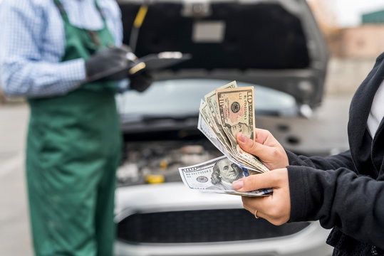 Female Hands With Dollars, Payment For Car Service