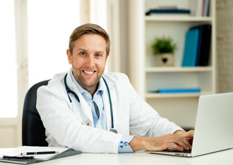 Fototapeta na wymiar Portrait of successful specialist doctor working in hospital office looking happy and confident