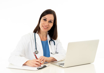 Female doctor working feeling up prescription and medical records using laptop isolated on white