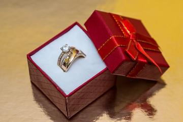 Golden ring crown in red present box