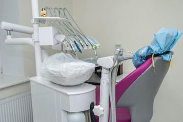 Fototapeta na wymiar Patient's chair in dentistry with tools and equipment