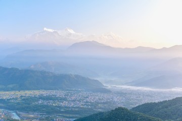 Misty Morning of the Pokhara Valley and the Himalayas Mountain Range