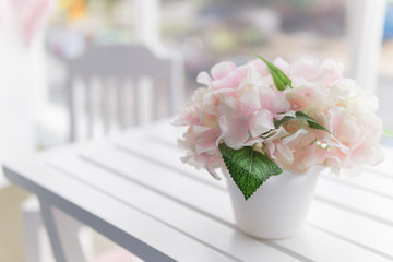 bouquet of flower at top of white wooden table