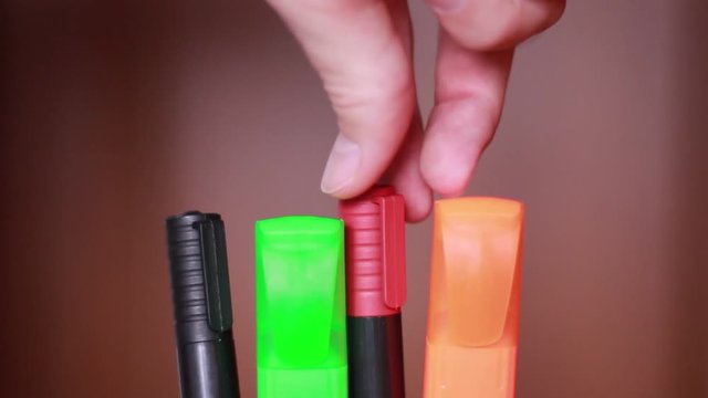 Choosing red marker closeup