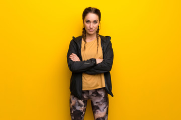 Sport woman on vibrant yellow background