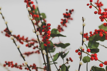 Christmas themed bunch of flowers with eucalyptus red holly berries and cotton