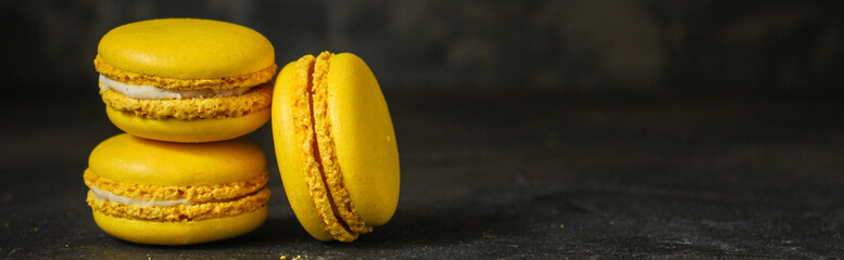 Fototapeta na wymiar macaron or macaroon cake, colorful cookies (dark background). copy space
