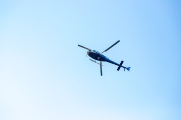 Fototapeta na wymiar Helicopter, blue sky