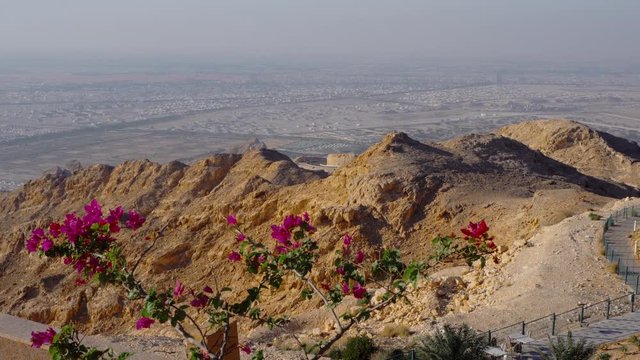 Beautiful view from the highest desert mountain on the city. The desert city stands in a blue haze.