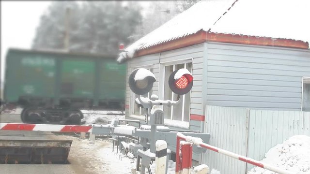 Red stop signal at a railway crossing.