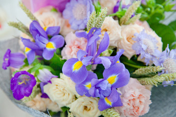 Purple irises and other flowers in the bouquet.