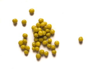 Fototapeta na wymiar small pile of peas scattered on white table 