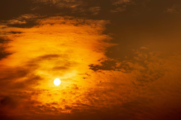 Sky and clouds reflected sunset light And a plane flying