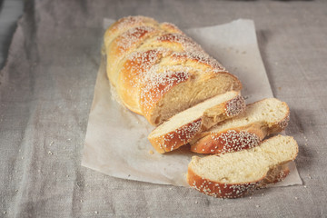 Sliced homemade bread served with cottage cheese on linen cloth