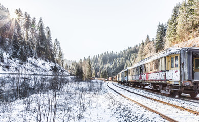 Train. Rusty. Snow. Winter. Hills. Forest