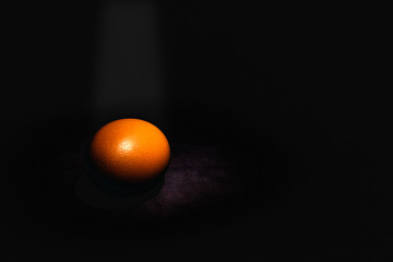 Raw eggs on dark background
