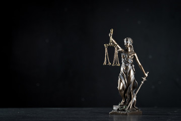  Goddess of justice on a beautiful black background. the subject of law