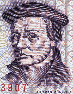 Thomas Muntzer on East German 5 mark (1975) banknote close up macro. Leading German radical Reformer during the Protestant Reformation. .