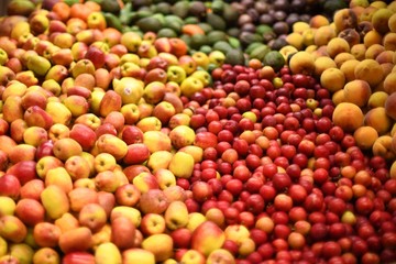 Naklejka na ściany i meble Piles of various fruits in market